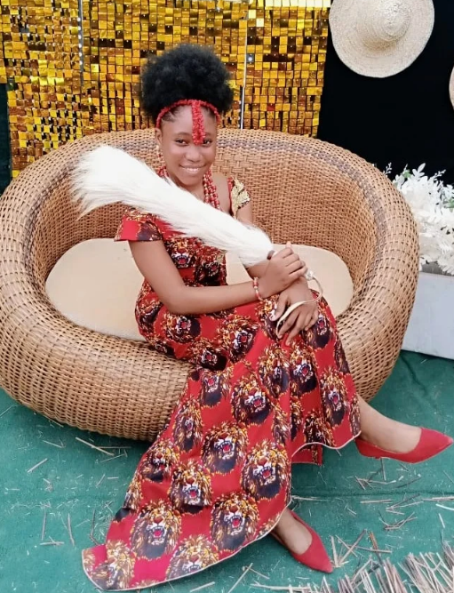 Young woman wearing an Ankara gown sewn during training at Jovibest Fashions
