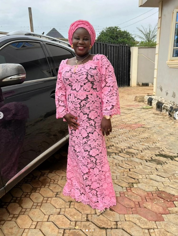 Founder of Jovibest Fashions in a pink lace gown and matching gele